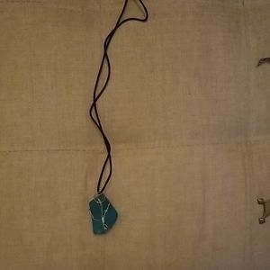 Topaz like stone on string